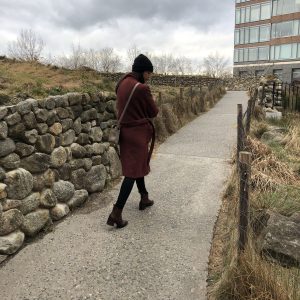 A woman walks through the Irish Hunger Memorial in Battery Park, NYC